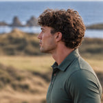 Side portrait showing the collar and short sleeve of the Deep Cypress Biome polo.
