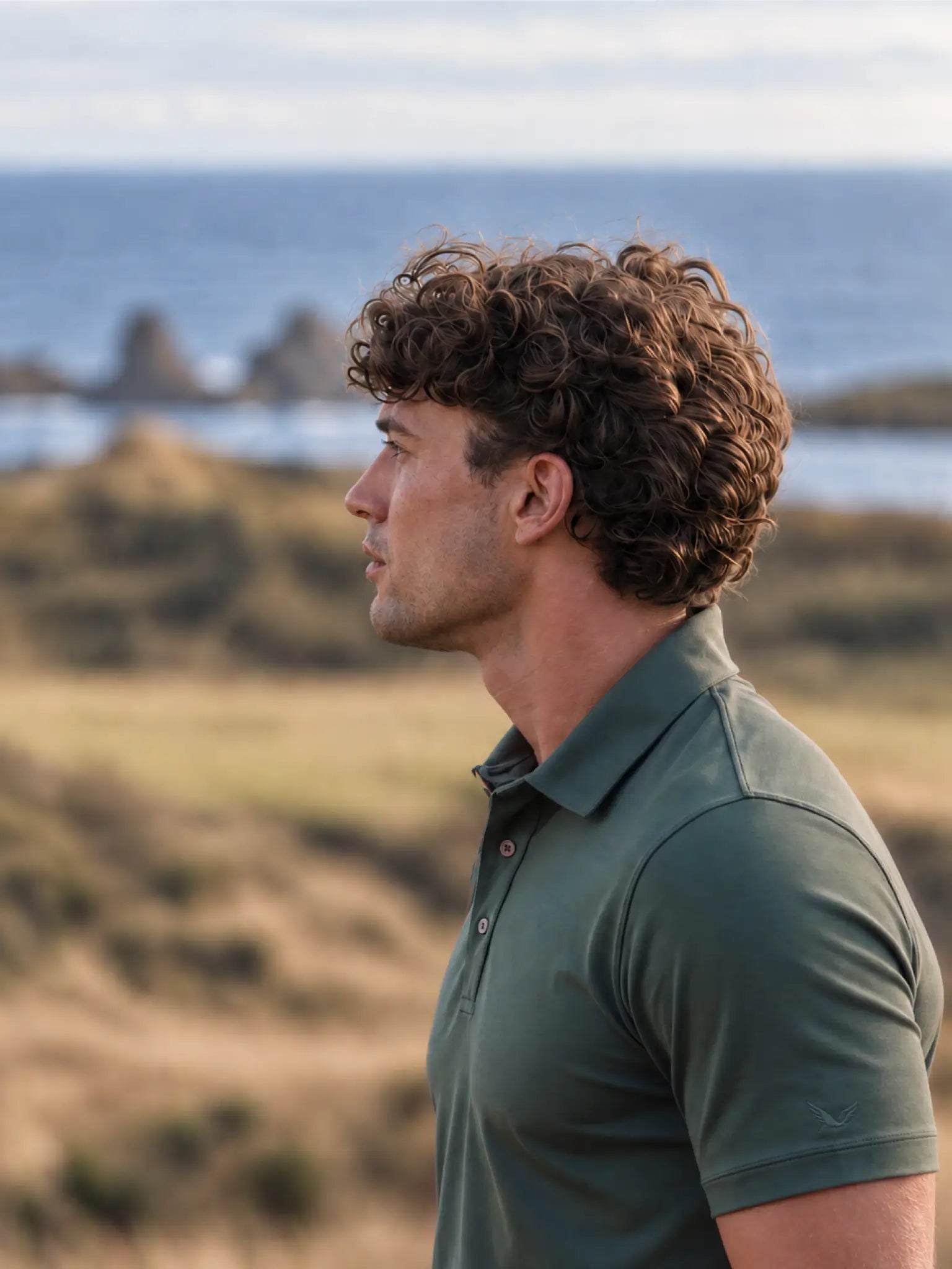 Side portrait showing the collar and short sleeve of the Deep Cypress Biome polo.