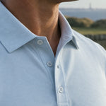 Detail of the Glacier Biome polo collar and button placket in light blue.