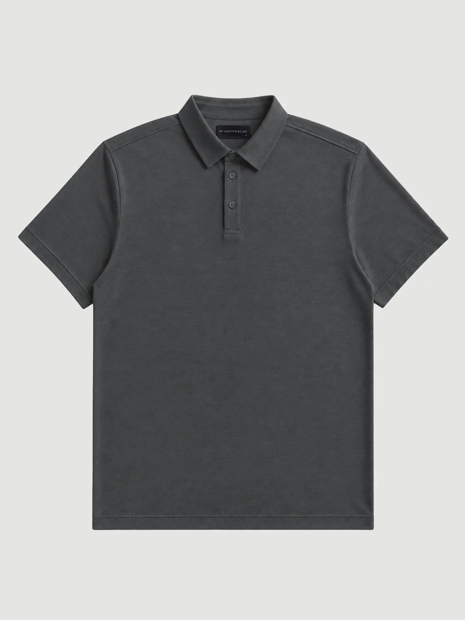 Front product view of the charcoal Volcanic Ash Biome polo, showing its collar, button placket and short sleeves.